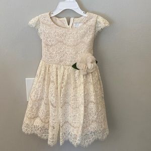 Dress,cream color sequins, zipper and bow in the back